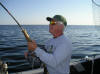 Royce Williams reeling in a Laker with the Johnson rod