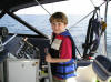 Grandson Cooper Harrison Smith (6) steering the boat returning to port.