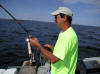 Tom Foster reeling in a Laker on the Johnson rod