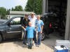 Emily, Ian, John, and Kieran Devery with their Lake troiut.